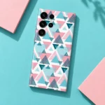 Pink, turquoise and deep teal abstract triangle pattern mobile skin on a white background, aqua flat lay