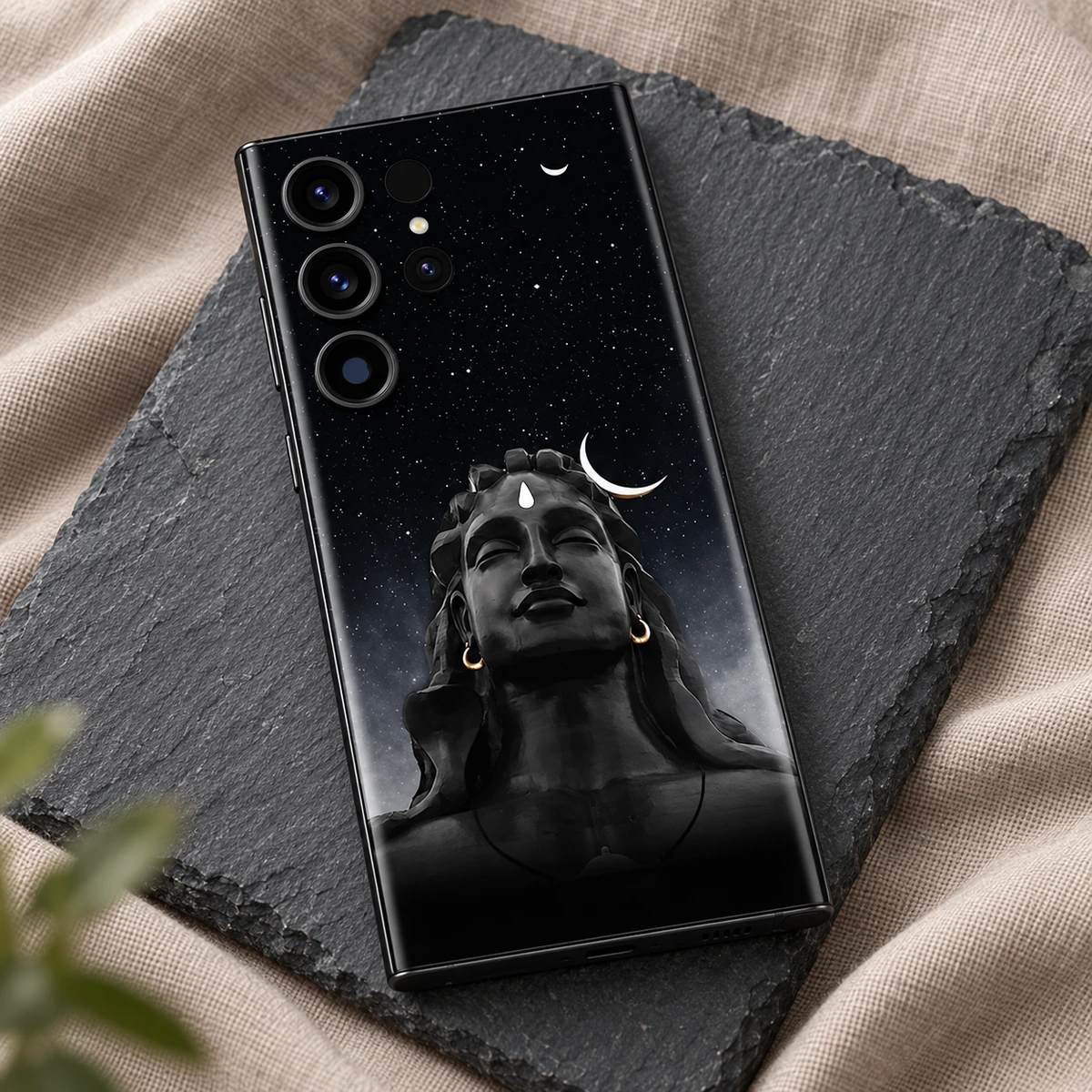 Adiyogi Starry Night Mobile Skin - slate flat lay Adiyogi portrait mobile skin with stars and white crescent details on charcoal slate and taupe linen