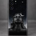 Close view of Adiyogi statue portrait with white crescent and gold earrings on a black starry mobile skin