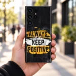 Always Keep Positive quote mobile skin in black, yellow and white, city handheld view