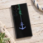 Black Anchor Mobile Skin with green rope and blue-purple anchor, driftwood flat lay