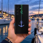Black Anchor Mobile Skin with green rope and blue-purple anchor, marina hand-held view