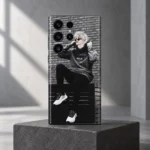 Anime Boy Streetwear Mobile Skin shown upright on a concrete block in a grey studio