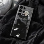 Anime Boy Streetwear Mobile Skin shown back-up on dark fabric beside a blurred white sneaker