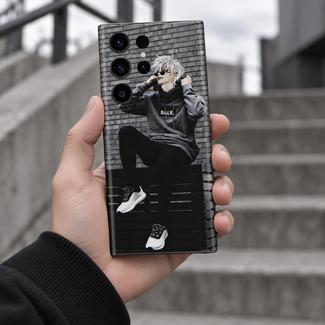 Anime Boy Streetwear Mobile Skin - Urban handheld view Anime Boy Streetwear Mobile Skin shown held in front of blurred urban steps