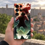 Attack on Titan Battle Mobile Skin held against a blurred old stone city backdrop