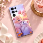 Pastel mobile skin showing two cuddling kittens and pink blossoms, pastel café flat lay