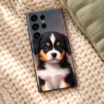 Baby Dog mobile skin with black white and tan puppy portrait, cozy knit flat lay