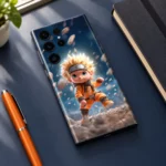 Baby Naruto mobile skin with blond chibi ninja in orange, navy desk view