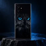 Black owl mobile skin with vivid cyan-blue eyes and charcoal feather artwork, blue slate hero view