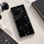 Black Space Planet & Constellation Mobile Skin shown daylight astronomy desk flat lay