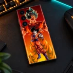 Blue Saiyan Goku Anime Mobile Skin lying on an amber-lit gaming desk