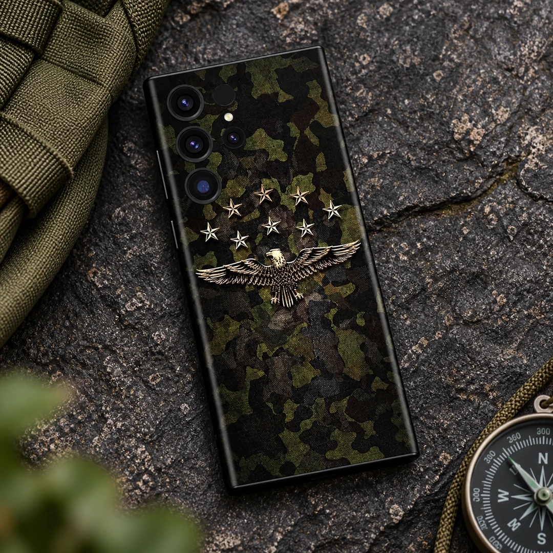Camo Alien Eagle Mobile Skin - Outdoor Flat Lay Olive camouflage mobile skin with a gold eagle and eight stars, outdoor flat lay