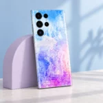 Angled Colorful Art phone skin against a lilac studio arch
