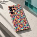 Colorful Pattern phone skin on pale concrete with a teal acrylic accent