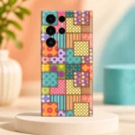 Colourful patchwork mobile skin with floral panels, polka dots, stripes and printed stitch borders, pastel studio hero view