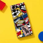 Comic pop art mobile skin with BANG POW BIFF lettering and colourful panels, yellow flat lay