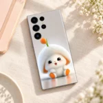 Cute white bunny mobile skin with orange accents, linen desk flat lay