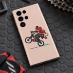 Peach Cyclist Wheelie Minimal Mobile Skin with red hoodie rider, workshop angle
