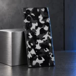 Black and grey camouflage mobile skin, steel studio display