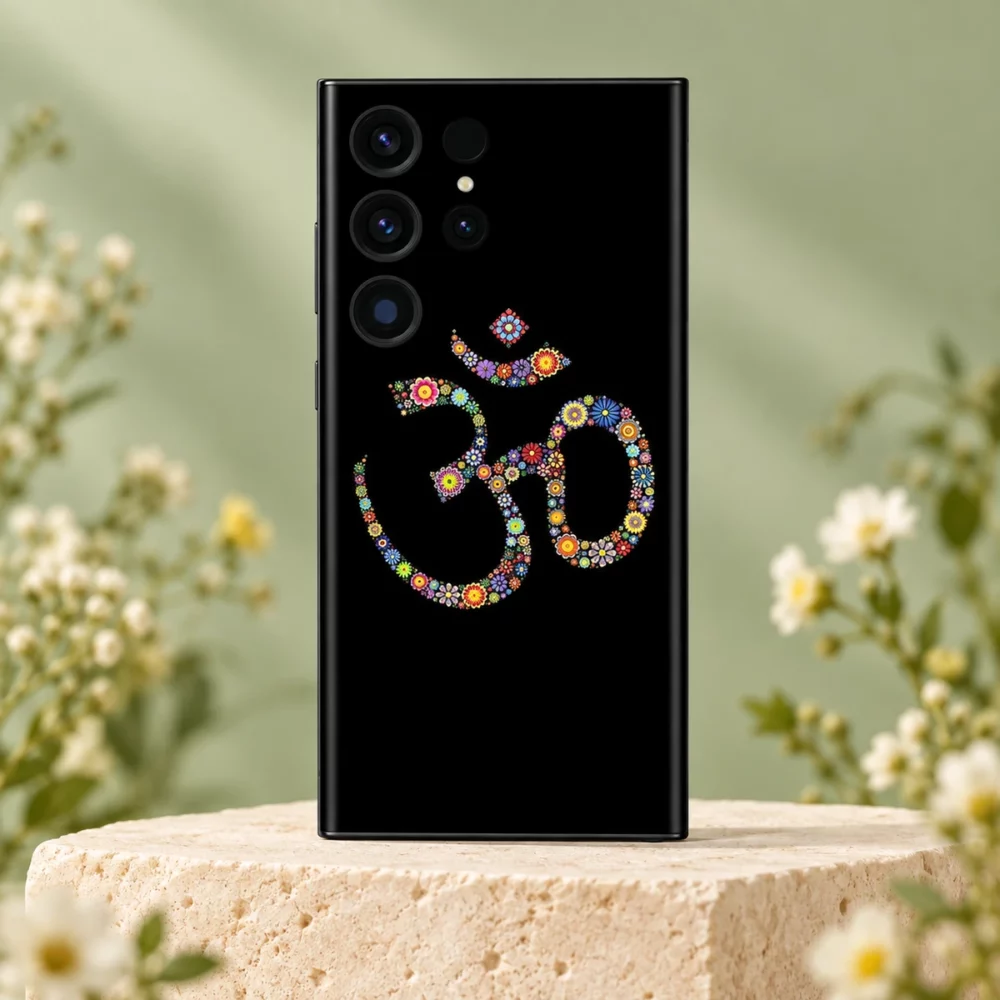 Floral Om symbol mobile skin with colourful flower motifs on black on an ivory stone pedestal