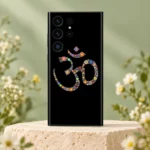 Floral Om symbol mobile skin with colourful flower motifs on black on an ivory stone pedestal
