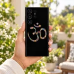 Handheld floral Om mobile skin with colourful flower motifs in a sunlit garden