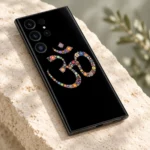 Detailed view of tiny colourful flowers forming the Om symbol on black mobile skin