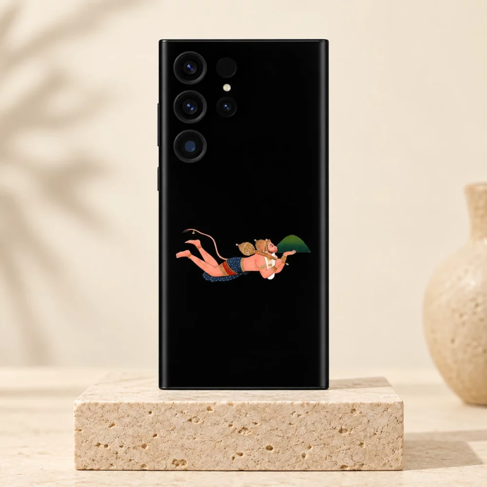 Flying Hanuman black mobile skin upright on a light travertine plinth