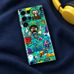 Turquoise funny blue doodle mobile skin with colorful sticker characters, navy flatlay