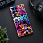 Future Gamer Mobile Skin with colorful controller graffiti in a gaming desk flat lay photograph
