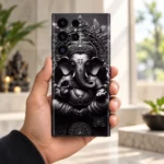 Ganesh Statue Black and Silver Mobile Skin held in hand in a bright stone interior