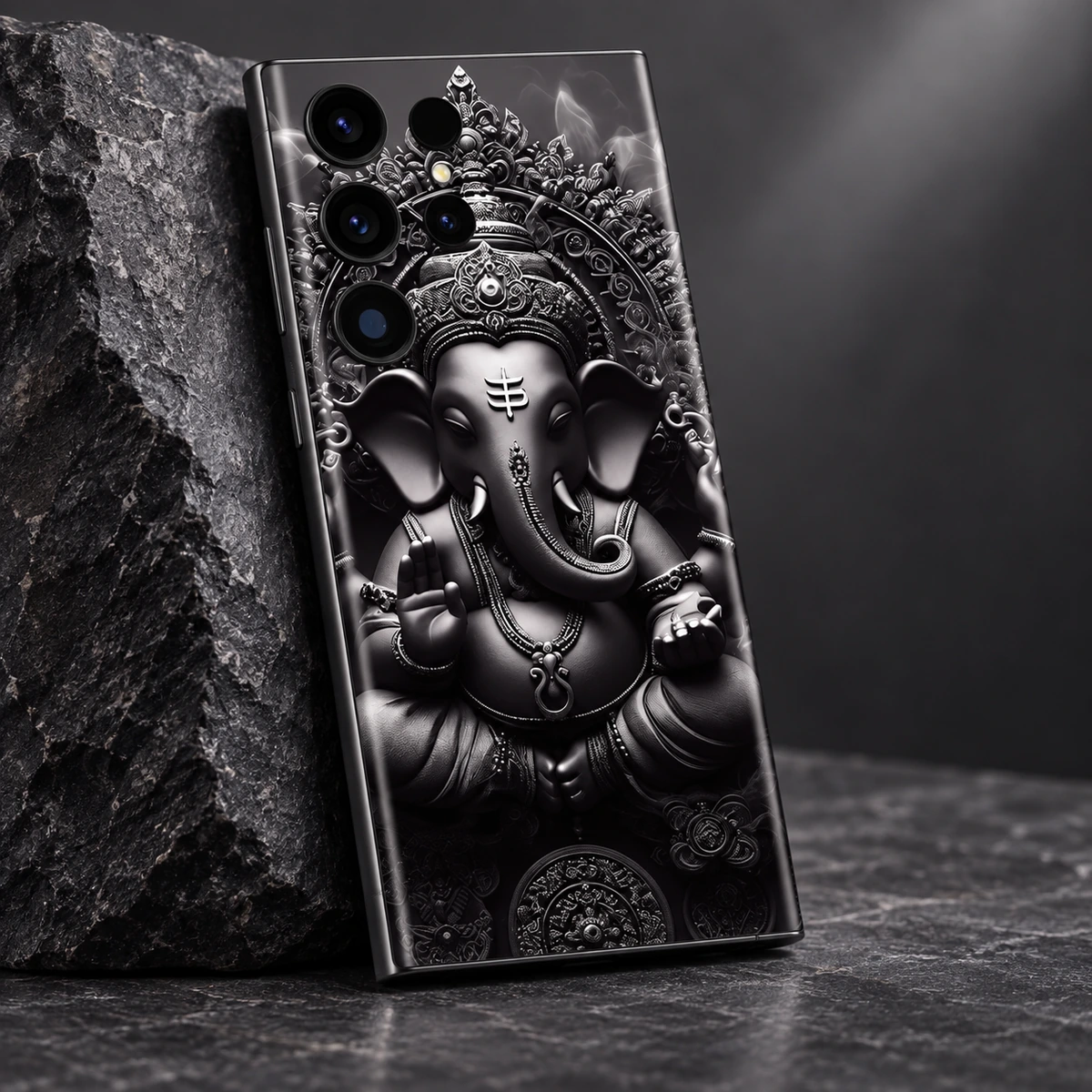 Ganesh Statue Mobile Skin - artwork detail Close view of ornate Ganesha crown and curved trunk artwork on black and silver mobile skin