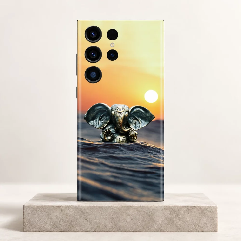 Lord Ganpati sunset water mobile skin with bronze Ganesha idol – clean studio hero