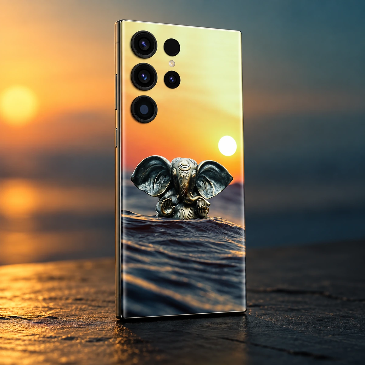 Lord Ganpati Sunset Water Mobile Skin – sunset studio Lord Ganpati sunset water mobile skin with bronze Ganesha idol – sunset studio