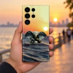 Lord Ganpati sunset water mobile skin with bronze Ganesha idol – in-hand lifestyle