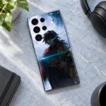 Giyu Tomioka anime mobile skin shown flat on a pale blue desk beside headphones