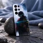 Giyu Tomioka mobile skin displayed with dark stone and soft blue fabric