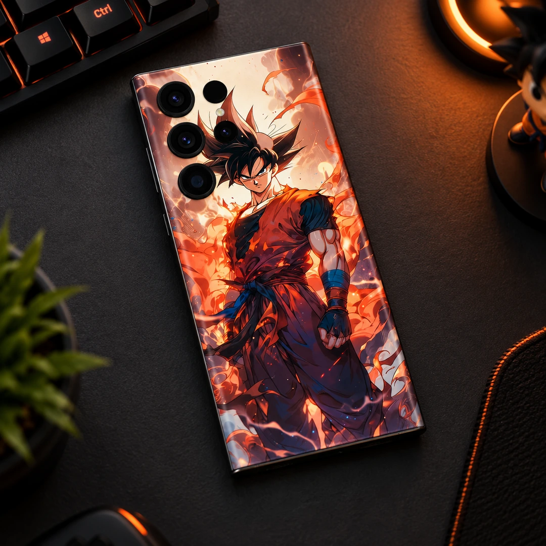 Goku Fiery Aura Mobile Skin - Gaming Desk Flat Lay Goku mobile skin with orange gi and fiery aura, gaming desk flat lay view