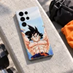 Goku Raised Arms Anime Mobile Skin on a sunlit training bench beside orange fabric