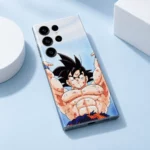 Goku Raised Arms Anime Mobile Skin lying diagonally on a pale blue studio surface