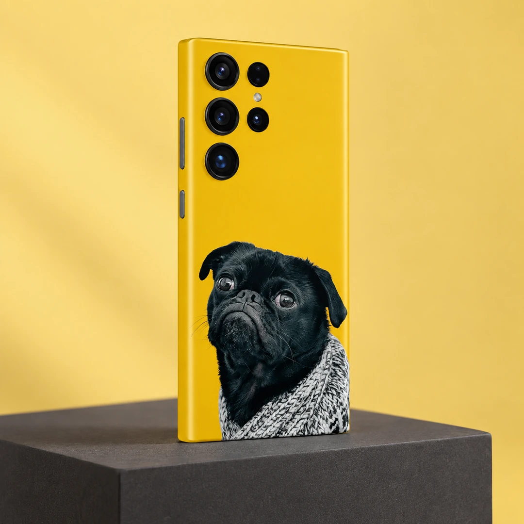 Grumpy Black Pug Mobile Skin - Yellow studio angle Yellow mobile skin featuring a grumpy black pug in a grey knitted blanket - yellow studio angle