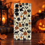 Halloween pattern mobile skin with pumpkins, witch hats and black cats on cream, autumn studio hero view