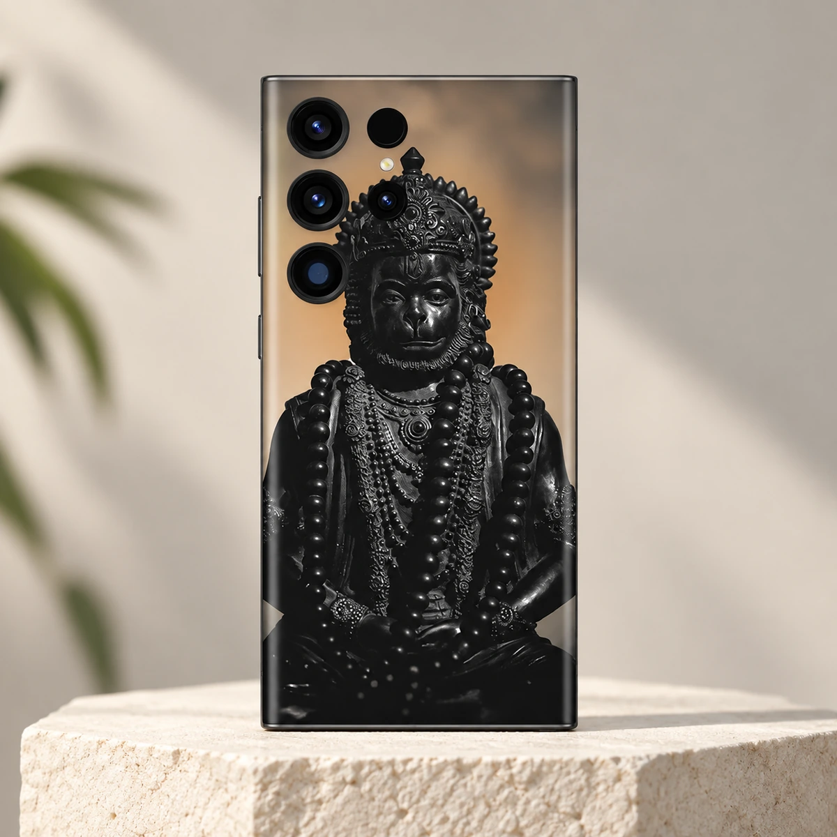 Hanuman Black Statue Portrait Mobile Skin - Ivory hero Hanuman black statue portrait mobile skin with ornate crown and bead garlands on an ivory pedestal
