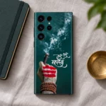 Teal Har Har Mahadev mobile skin on linen beside a notebook and brass dish
