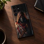 Hooded Assassin Mobile Skin shown in walnut desk flat lay