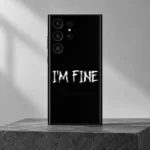 Black I'm Fine mobile skin with white distressed lettering, charcoal studio hero