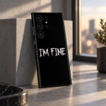 Black I'm Fine mobile skin with white distressed lettering, window light view