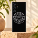 Black Indian mandala mobile skin with white Om and circular Devanagari mantra, sandstone studio hero