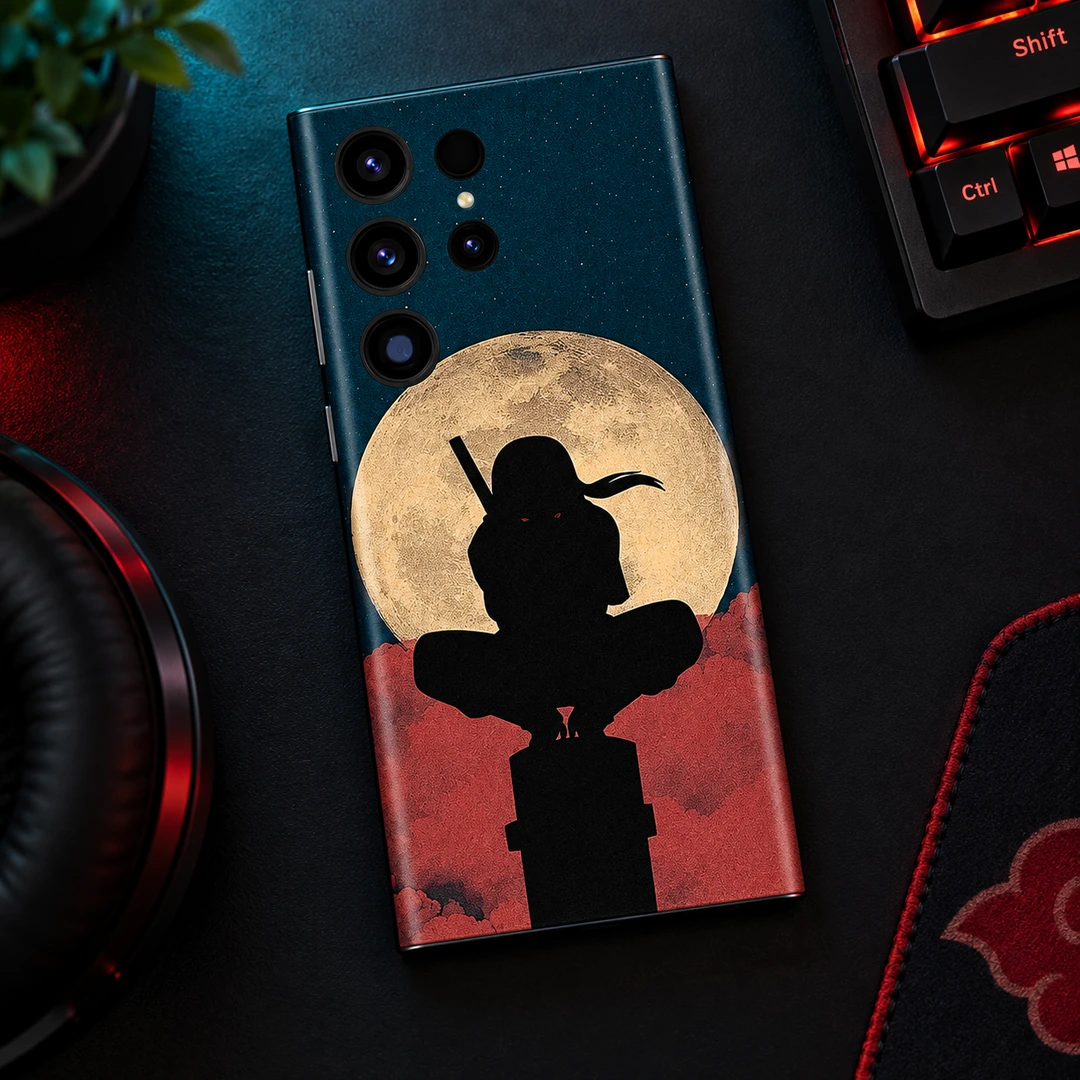 Itachi Moon Mobile Skin - Night Desk Flat Lay Itachi Moon mobile skin with black ninja silhouette and cream moon, night desk flat lay view